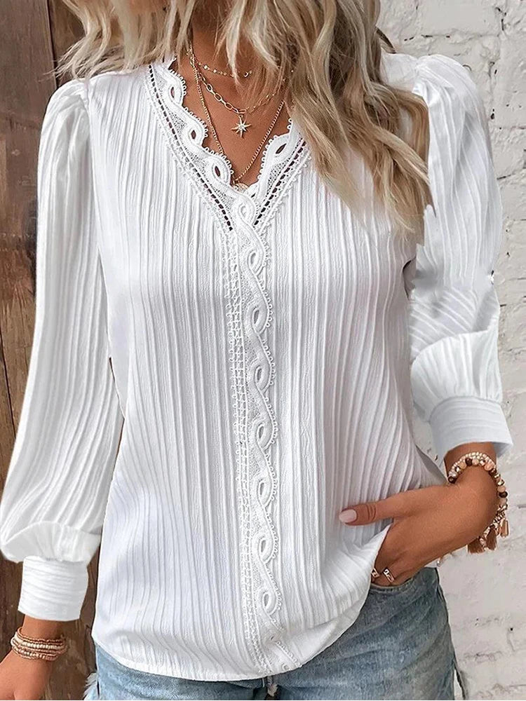Ivory chiffon blouse with intricate lace neckline details, relaxed feminine fit