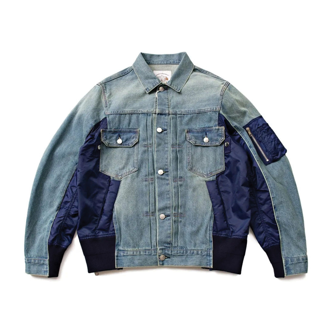 Blue patchwork denim nylon jacket with turndown collar, button closure, and zipper side panels
