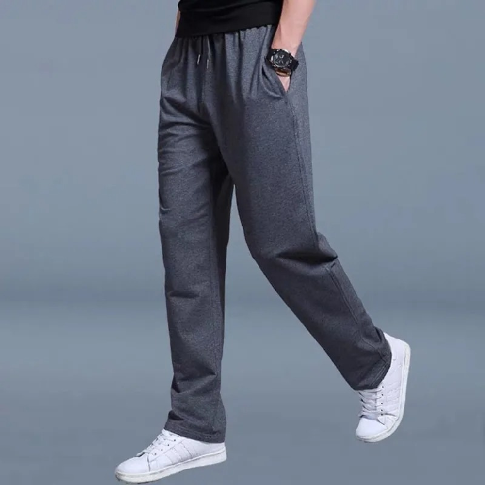Men's gray relaxed-fit jogger pants with elastic waistband, drawstring, and side pockets