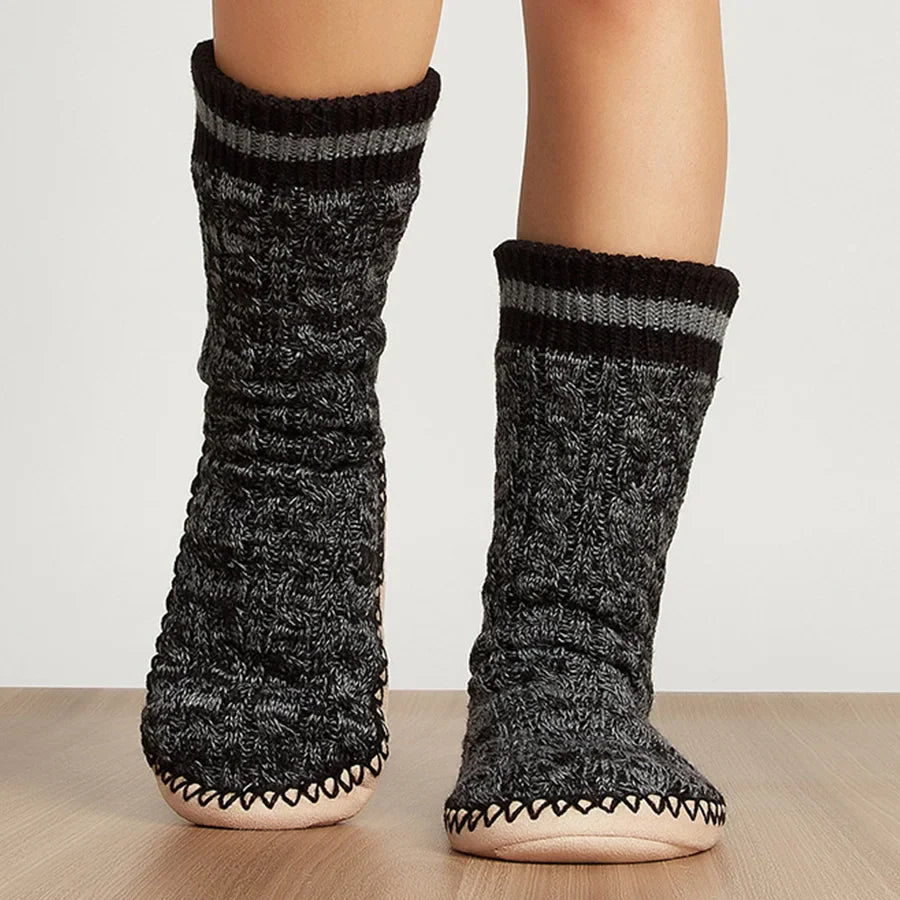 SoftSole plush lounge slippers with thick warm lining, sock-like fit, and non-slip sole