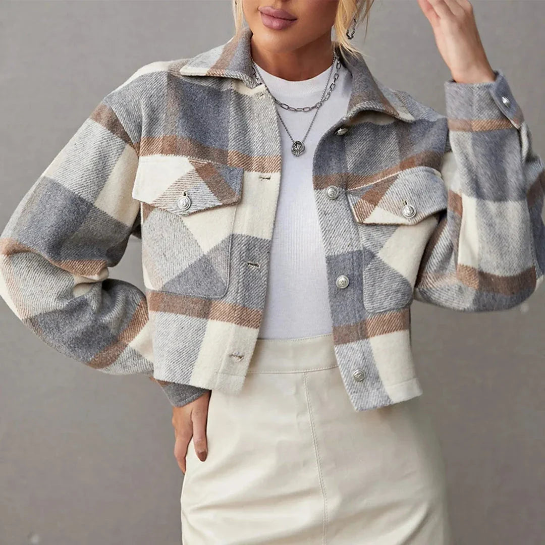 Cropped button-up plaid jacket with bold pattern, modern fit, and chest flap pockets