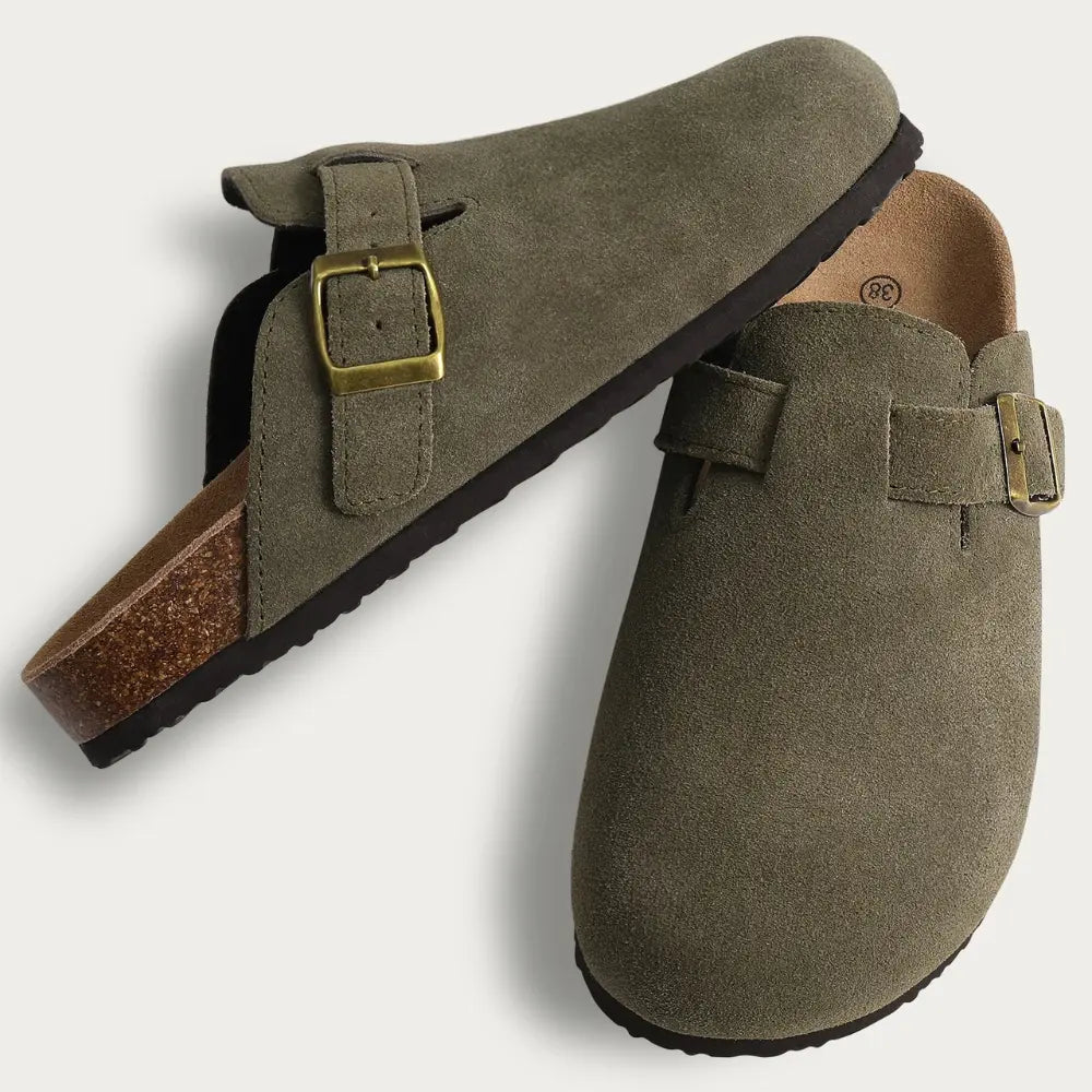 Women's cozy mule slippers in neutral tones with soft-brushed fabric and adjustable buckle strap