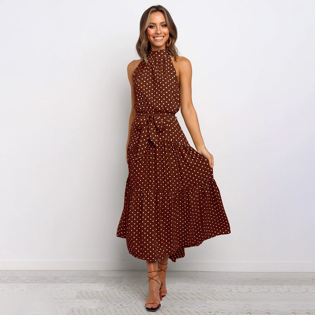 Polka dot halterneck maxi dress with defined waistband, sleeveless elegant silhouette