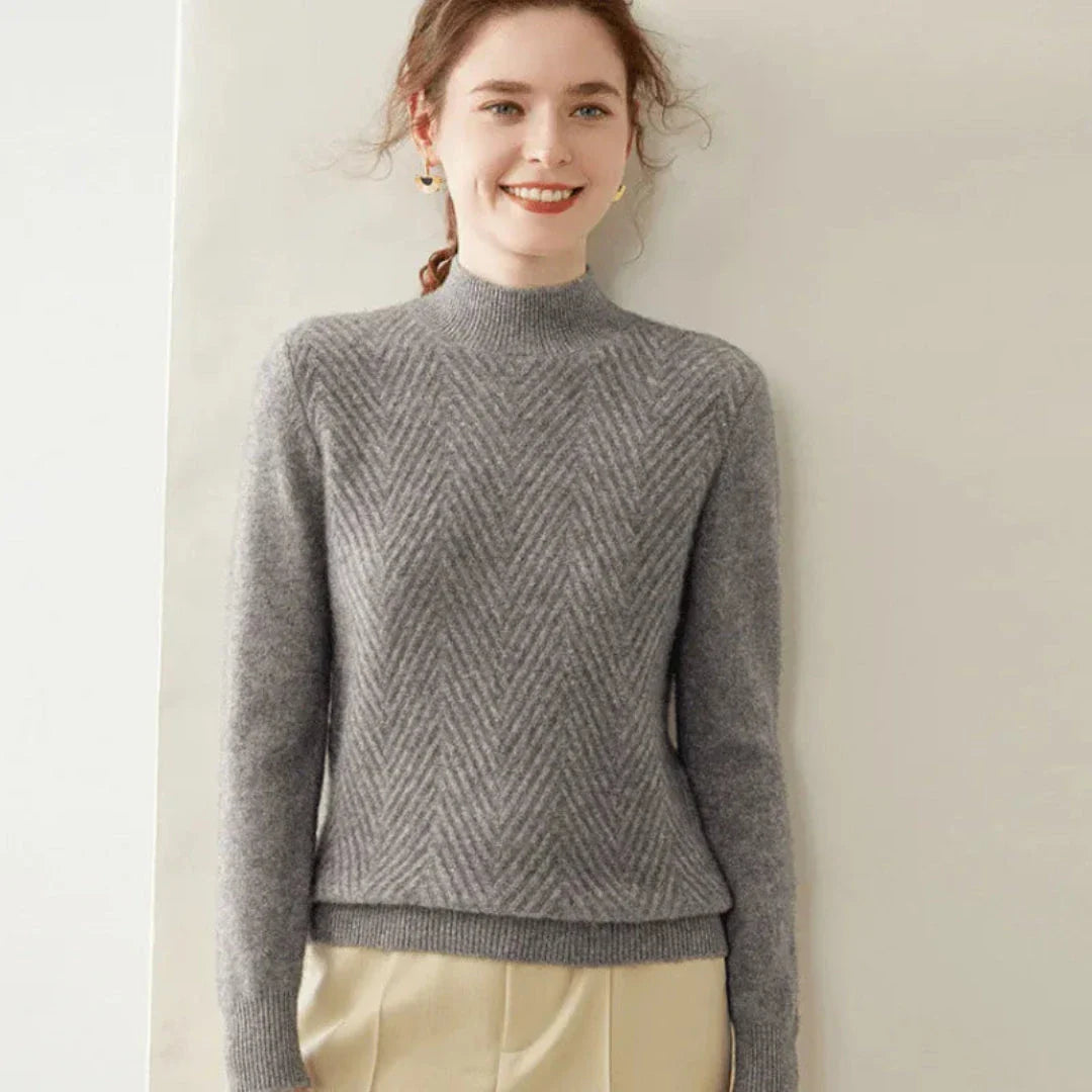 Ivory cashmere wool mock neck sweater with chevron knit pattern and ribbed cuffs