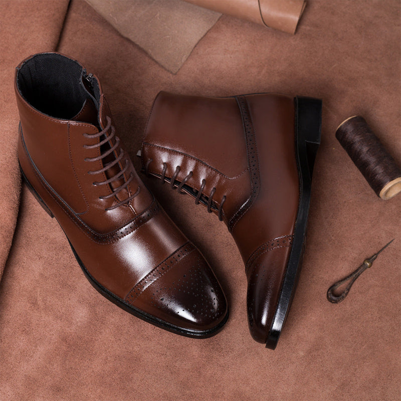 Dark brown leather lace-up boots with brogue cap toe detail and side zipper