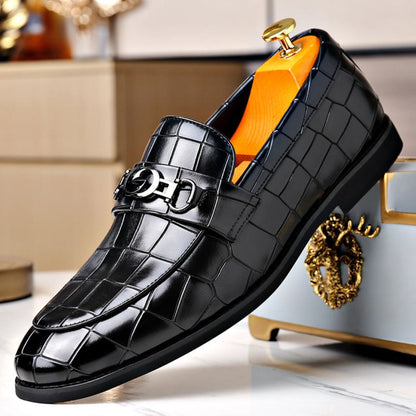 Men's textured leather loafers with polished finish and sleek metal buckle accent for formal or casual wear