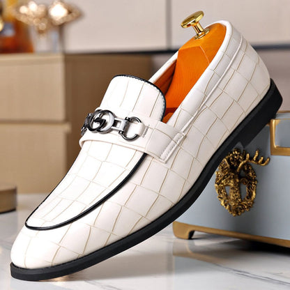 Men's textured leather loafers with polished finish and sleek metal buckle accent for formal wear