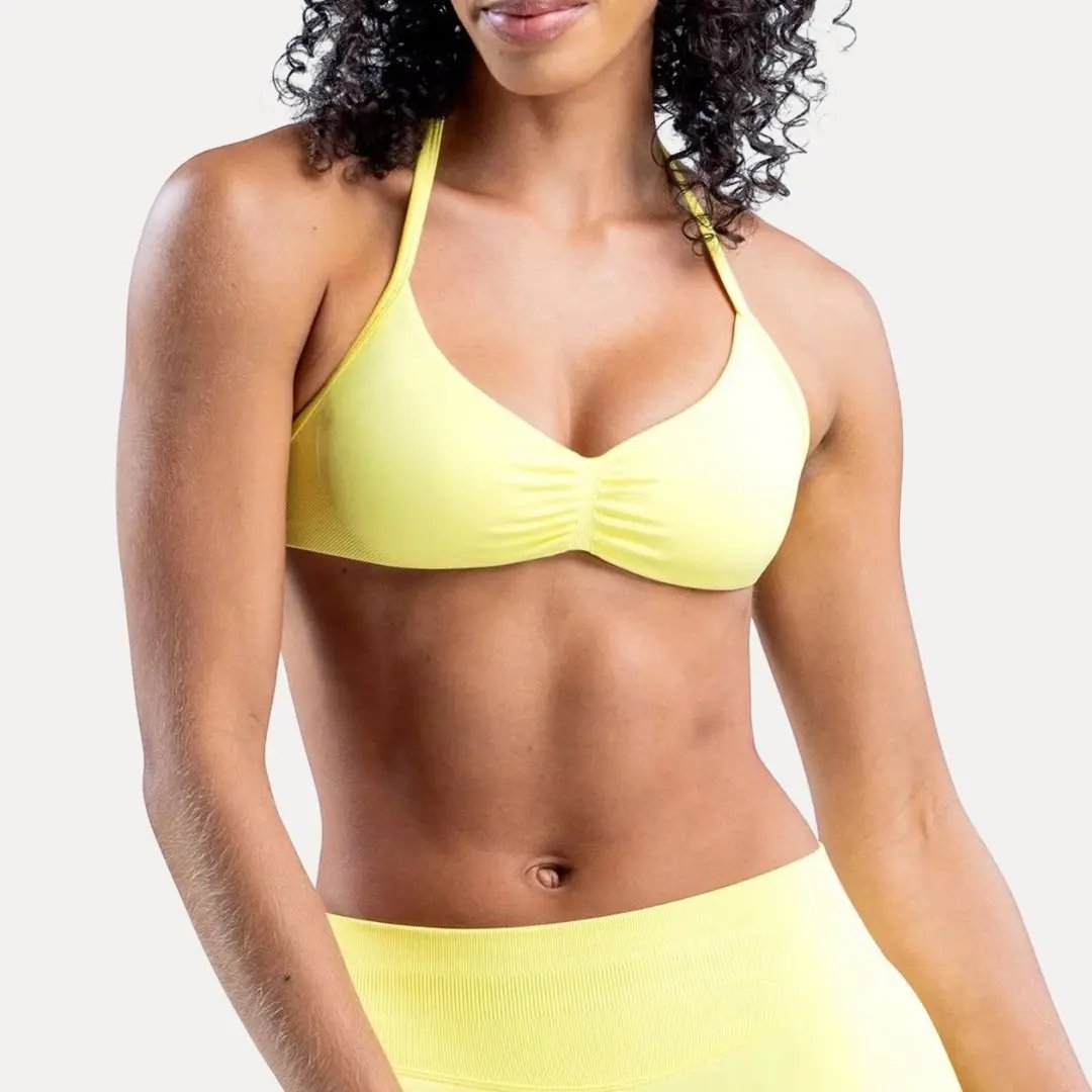 Andrea black backless halter sports bra with strappy design and removable padding for yoga and gym