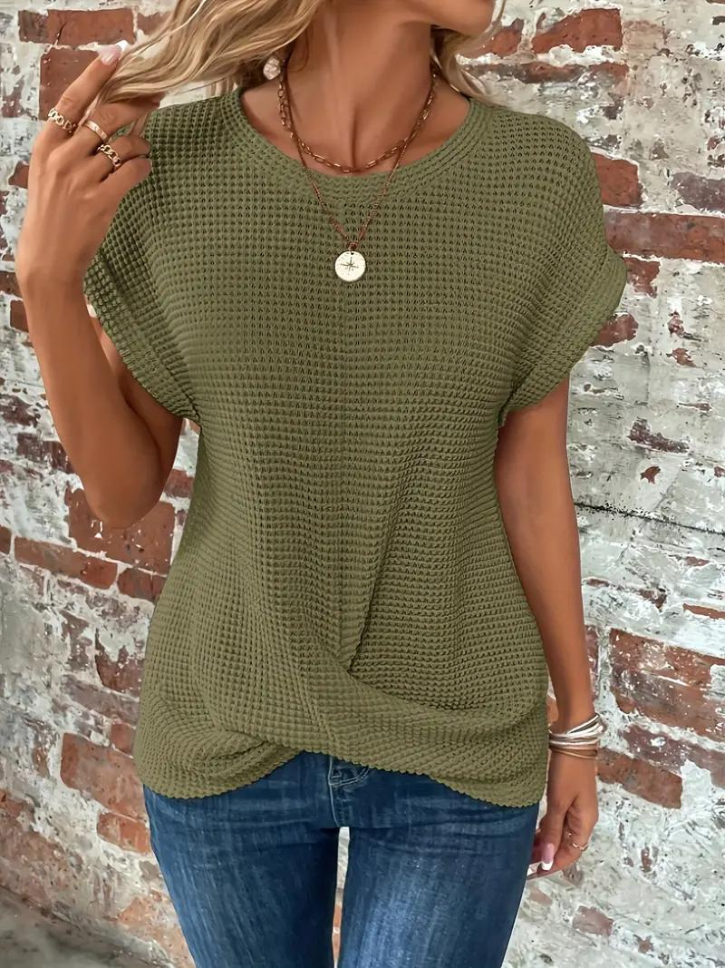 Cream waffle-knit tee with relaxed fit and front twist-hem detail for casual everyday style