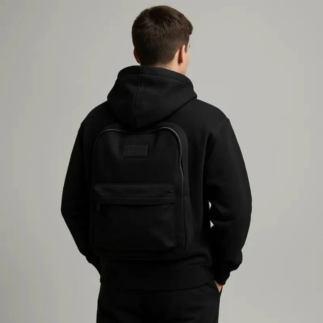 Black 2-in-1 pullover hoodie with built-in backpack, full-zip closure, minimalist travel style