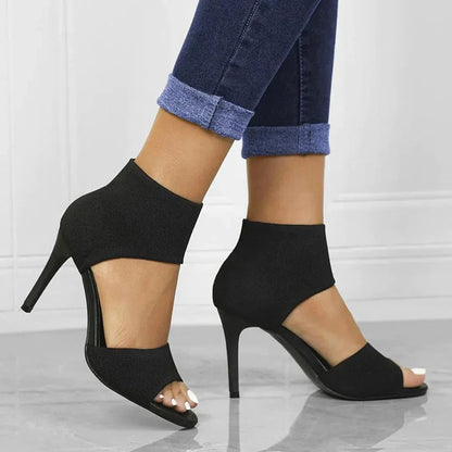Women's black stretch-knit stiletto sandals with open-toe design and slim high heel ankle cuff