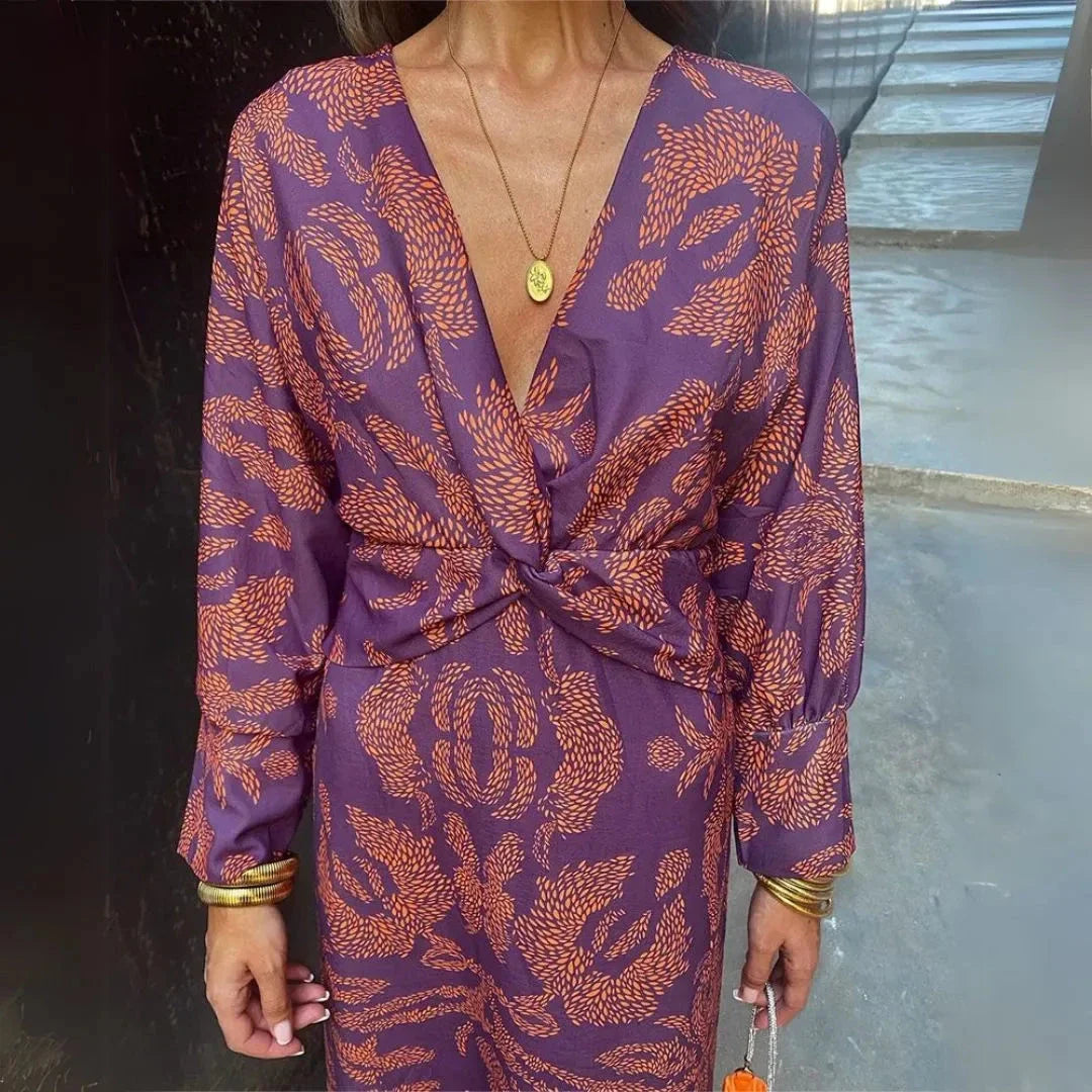 Flowy bohemian maxi dress with twist-front waist detail in warm-toned fabric for resort wear