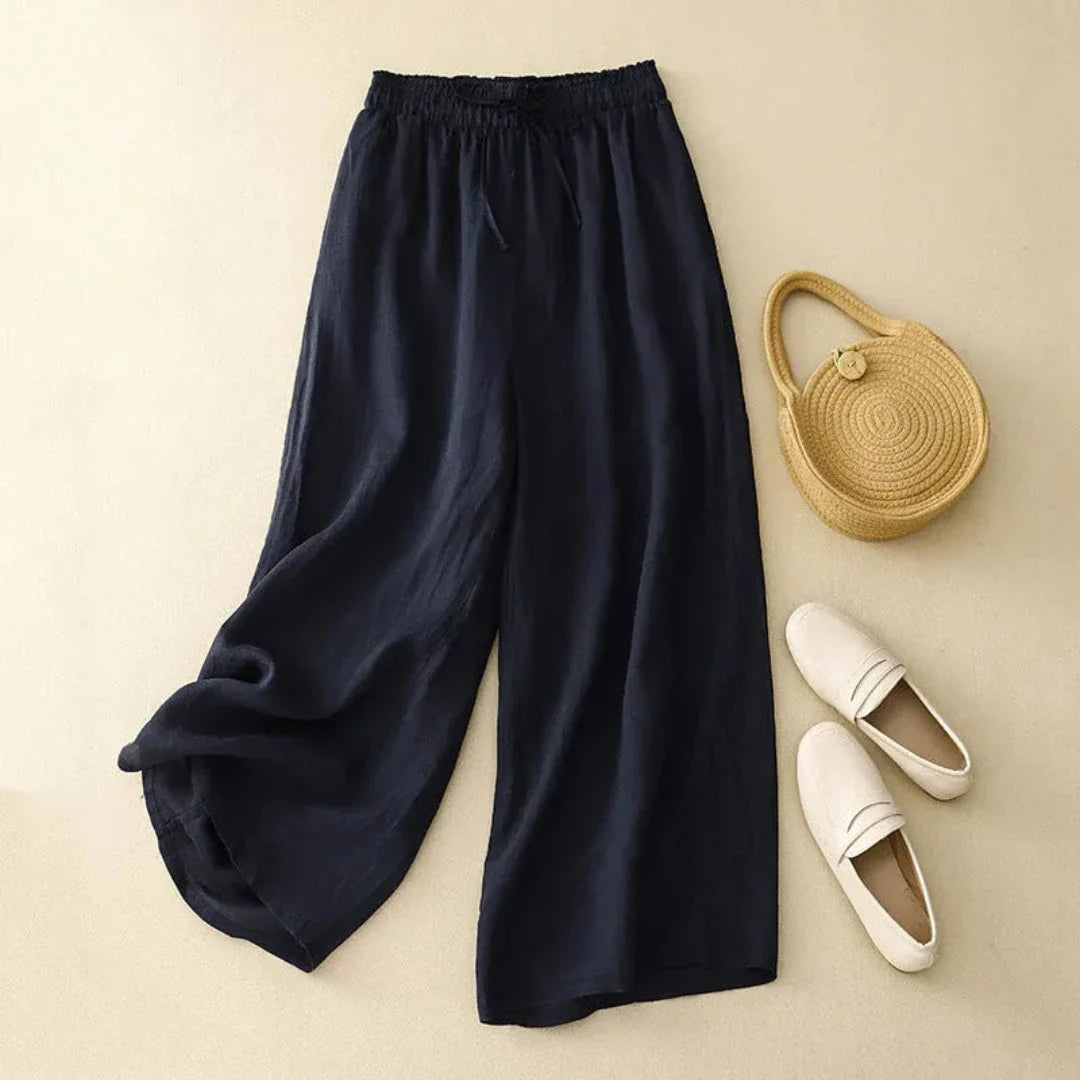 Beige linen wide-leg pants high-waist drawstring closure flowy silhouette resort style