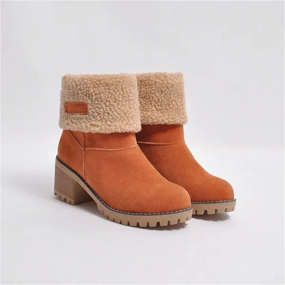 Women's mid-calf waterproof boots with soft lining, sleek silhouette, and all-weather cushioned sole