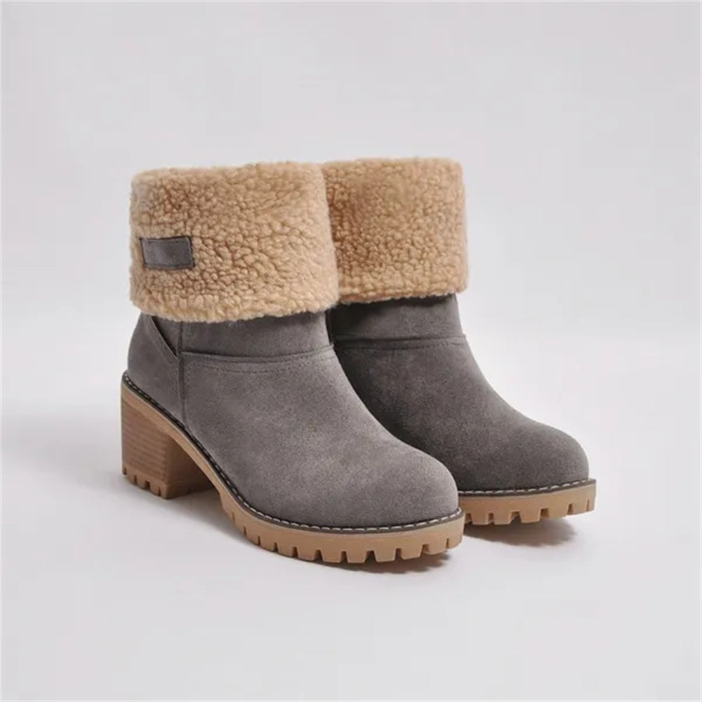 Women's mid-calf waterproof boots with sleek silhouette and soft cushioned lining for all-weather wear