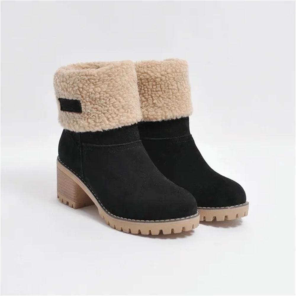 Women's mid-calf waterproof boots with soft lining, sleek silhouette, and all-weather protection