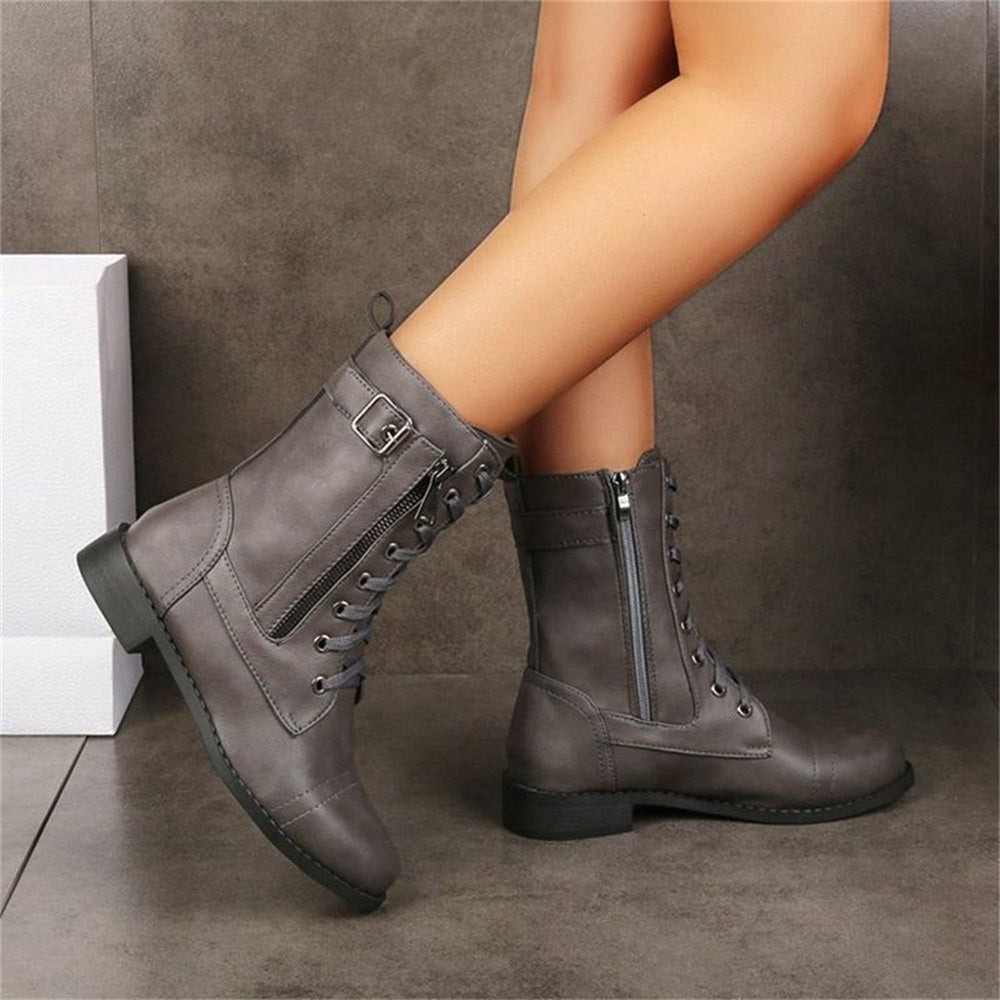 Black comfort ankle boots with toe-side zipper closure, cushioned insole, and supportive structured silhouette
