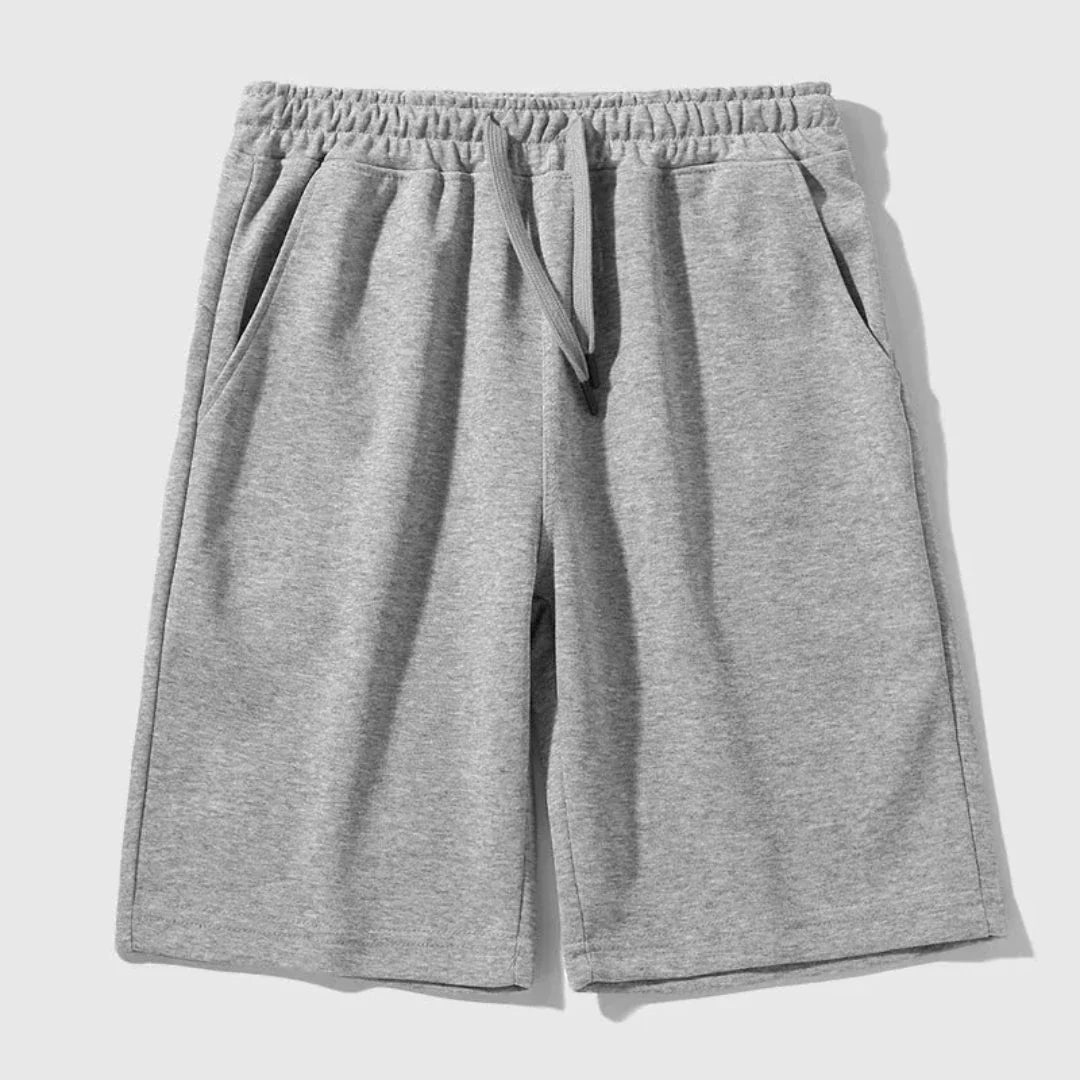 Men's relaxed knee-length jogger shorts in cotton-poly blend with adjustable drawstring waistband