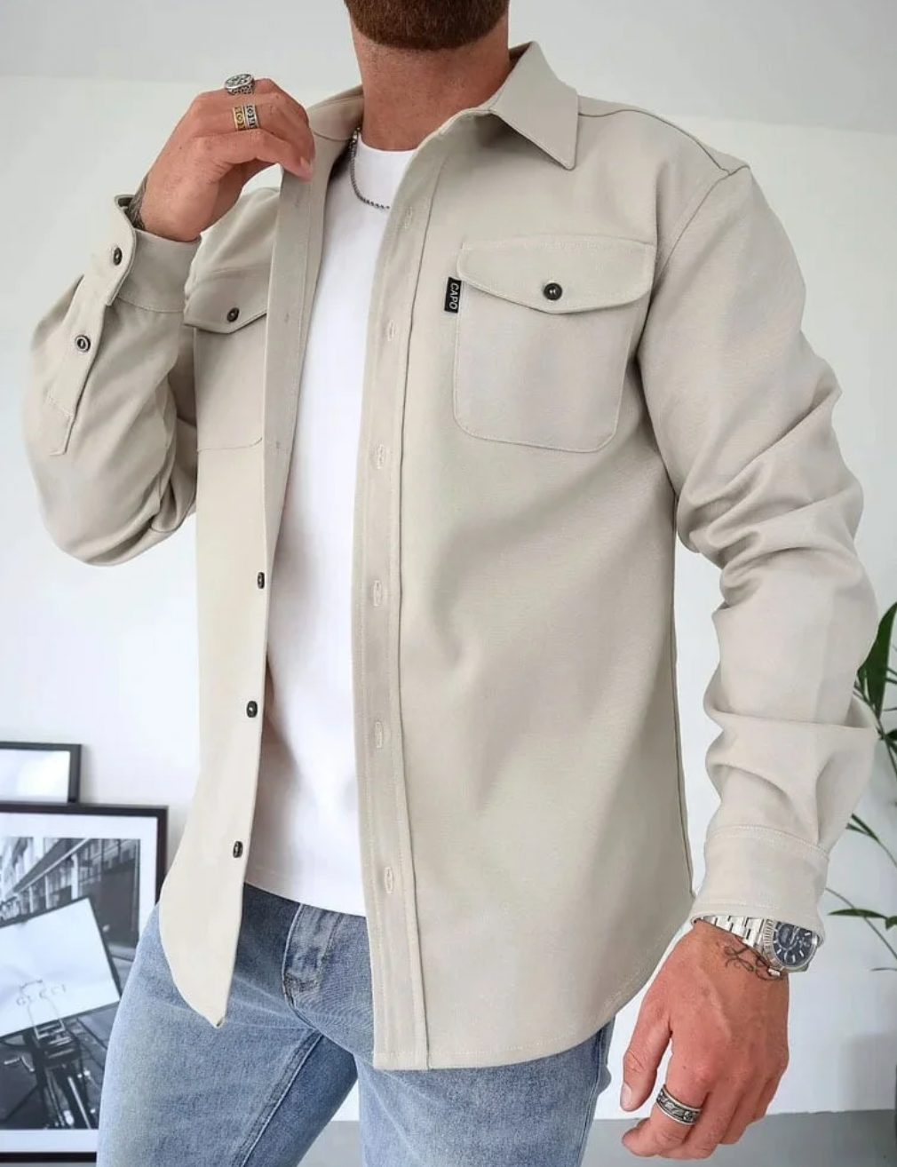 Men's casual cotton shirt jacket with button closure, chest pockets, and long sleeves in versatile style