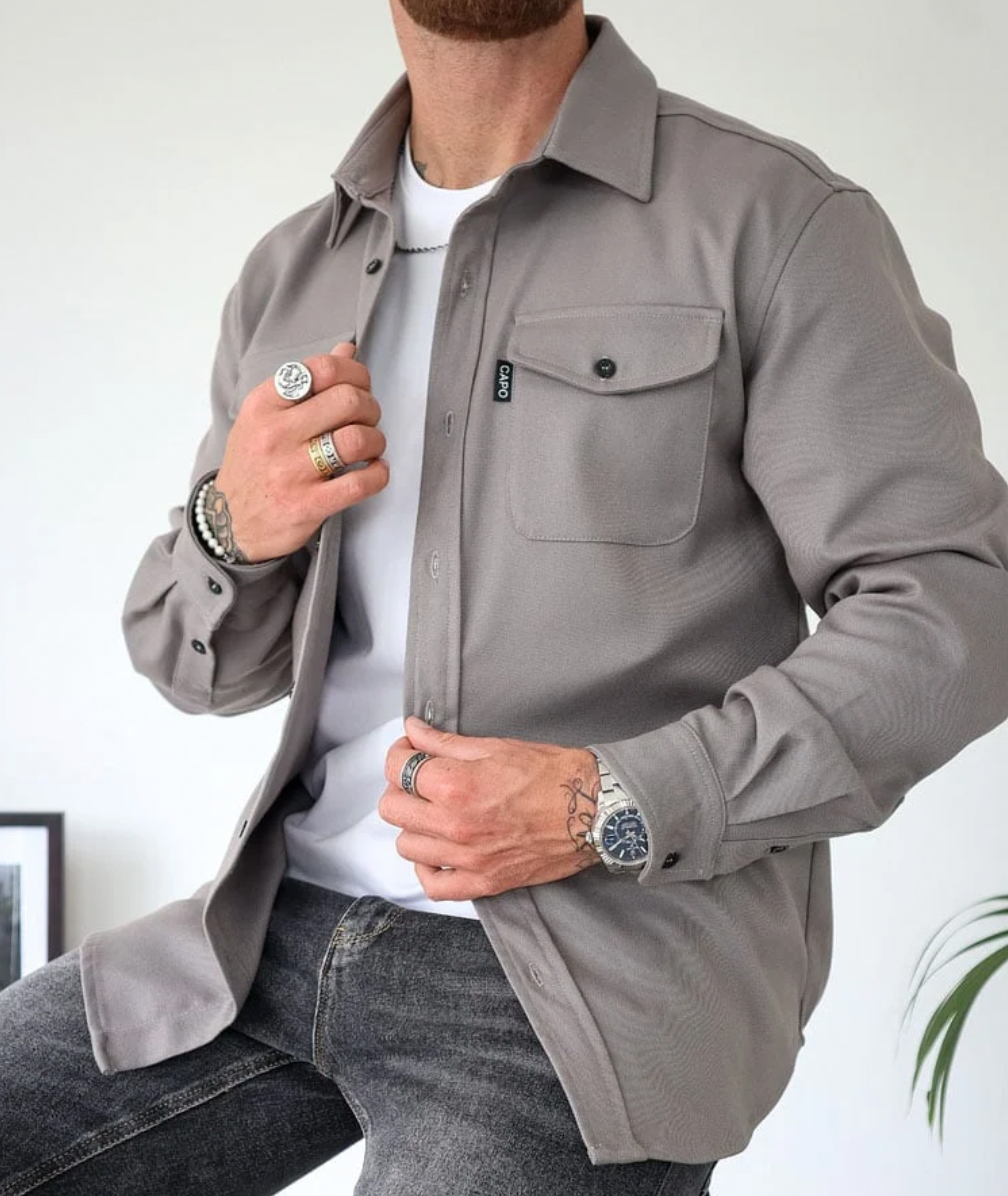 Men's casual cotton shirt jacket with button closure, chest pockets, and long sleeves in versatile style