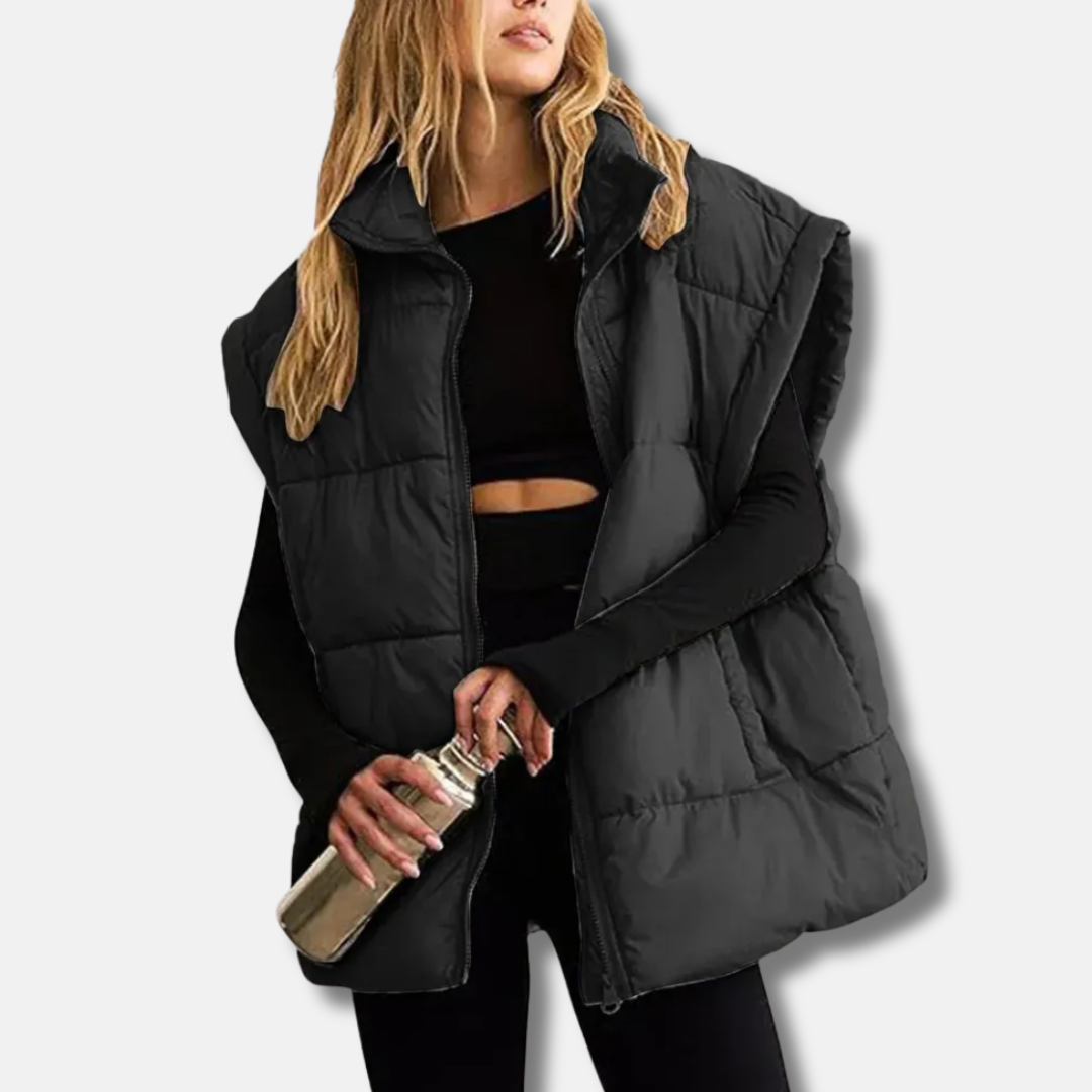 Women's quilted puffer vest hip-length silhouette with stand collar in versatile casual style