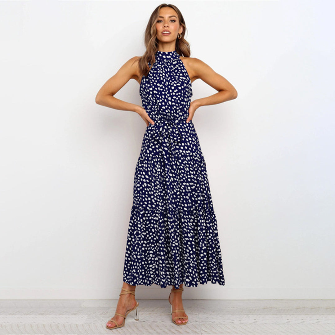 Women's light airy halterneck A-line dress, sleeveless with defining waistband, elegant long silhouette