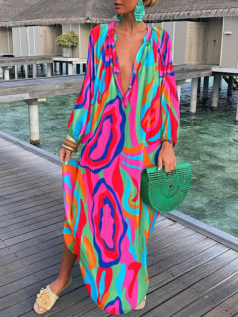 Colorful boho maxi dress with bold print, flowing ankle-skimming silhouette for resort-ready style