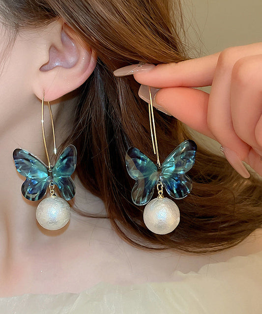 Boucles d'oreilles créoles en acrylique bleu avec perles et papillon - Wavlynn