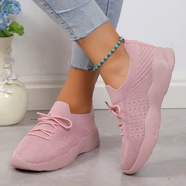 Women's lightweight gray slip-on knit sneakers with breathable upper and cushioned sole