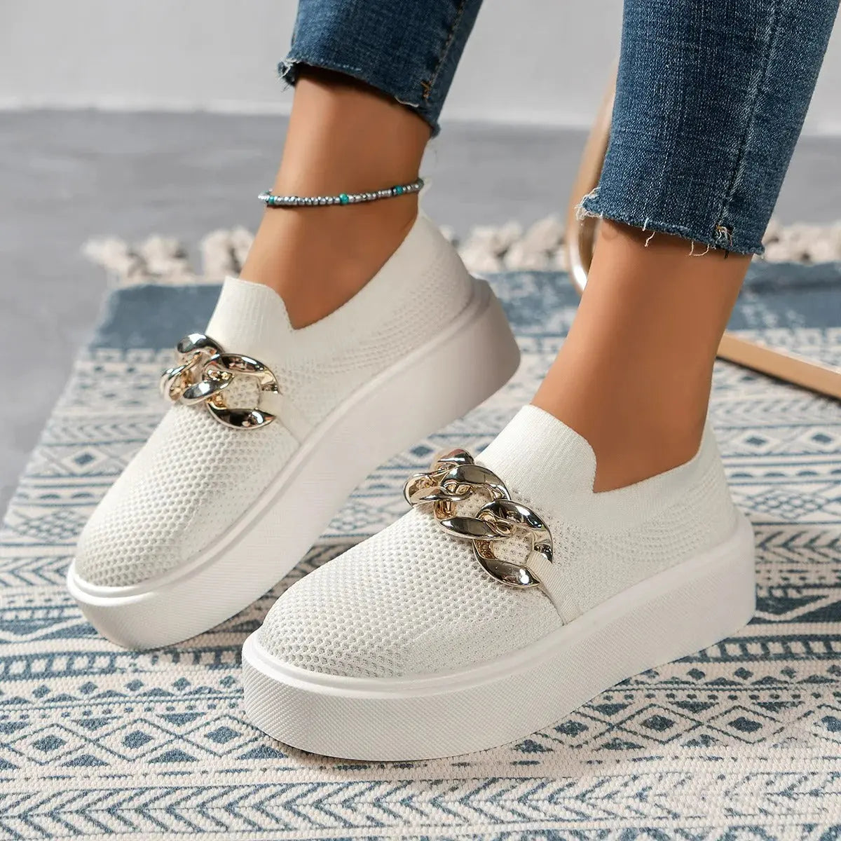 Women's white breathable slip-on sneakers with lightweight open-knit upper for casual style