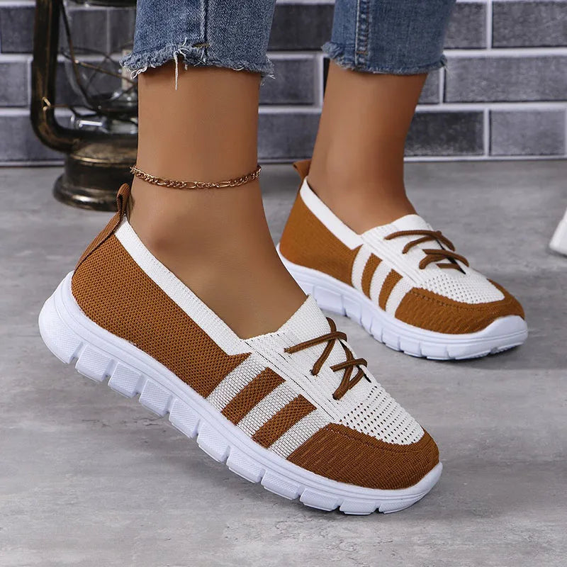 Women's white breathable slip-on sneakers with lightweight knit upper and casual chic style
