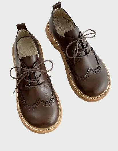 Women's brown brogue Oxford shoes wide-fit with intricate perforated detailing and classic wingtip design