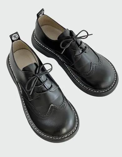 Women's brown brogue Oxford shoes wide-fit with decorative perforated detailing and elegant silhouette