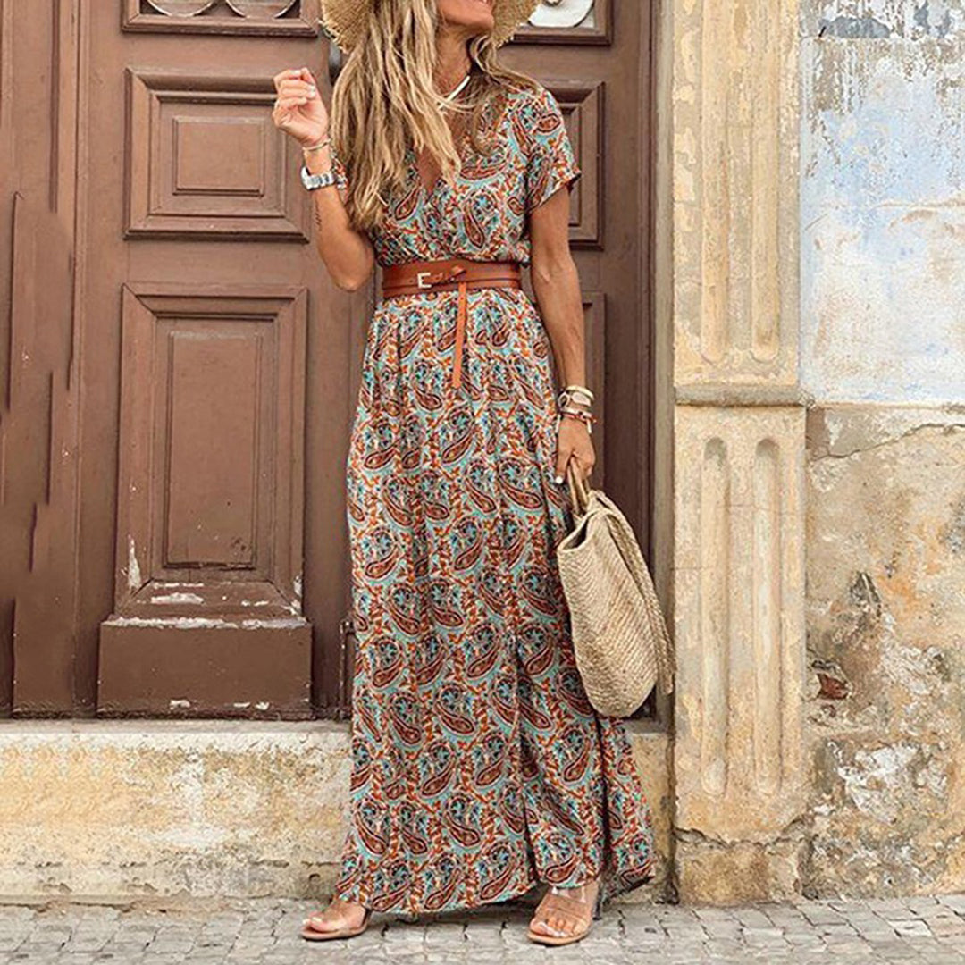Women's bohemian maxi dress with paisley print, V-neck, short sleeves, and flowing leg slit silhouette