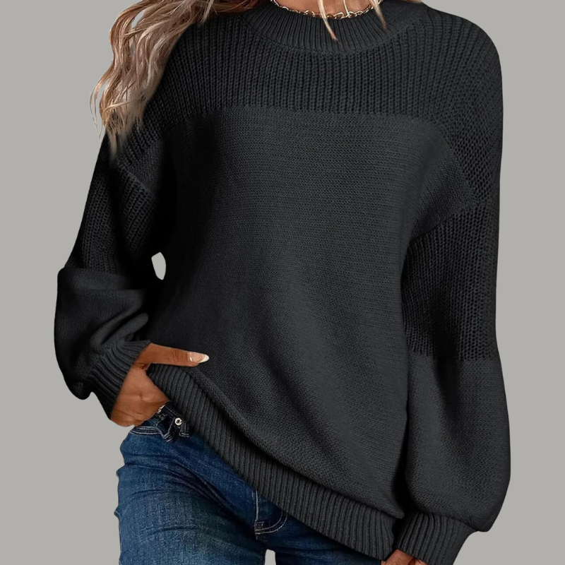 Cream loose-fitting knit sweater with relaxed drape, soft texture, and effortless casual elegance