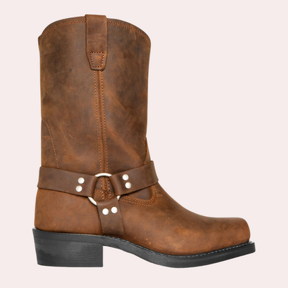 Men's brown leather harness boots with classic silhouette, sturdy heel, and iconic harness strap detail