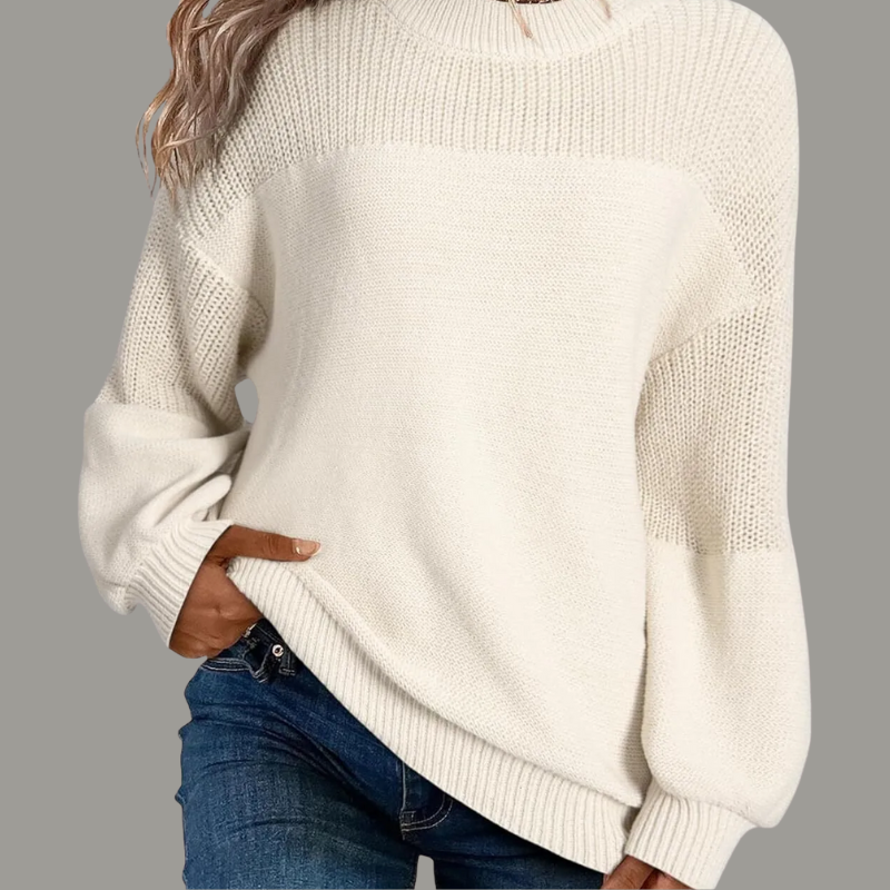 Beige loose-fitting knit sweater with relaxed silhouette and soft draped texture