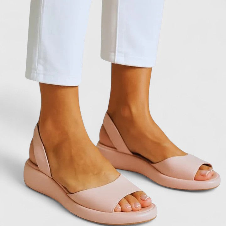 Women's bold yellow open-toe platform wedge slingback sandals with sculptural sole design