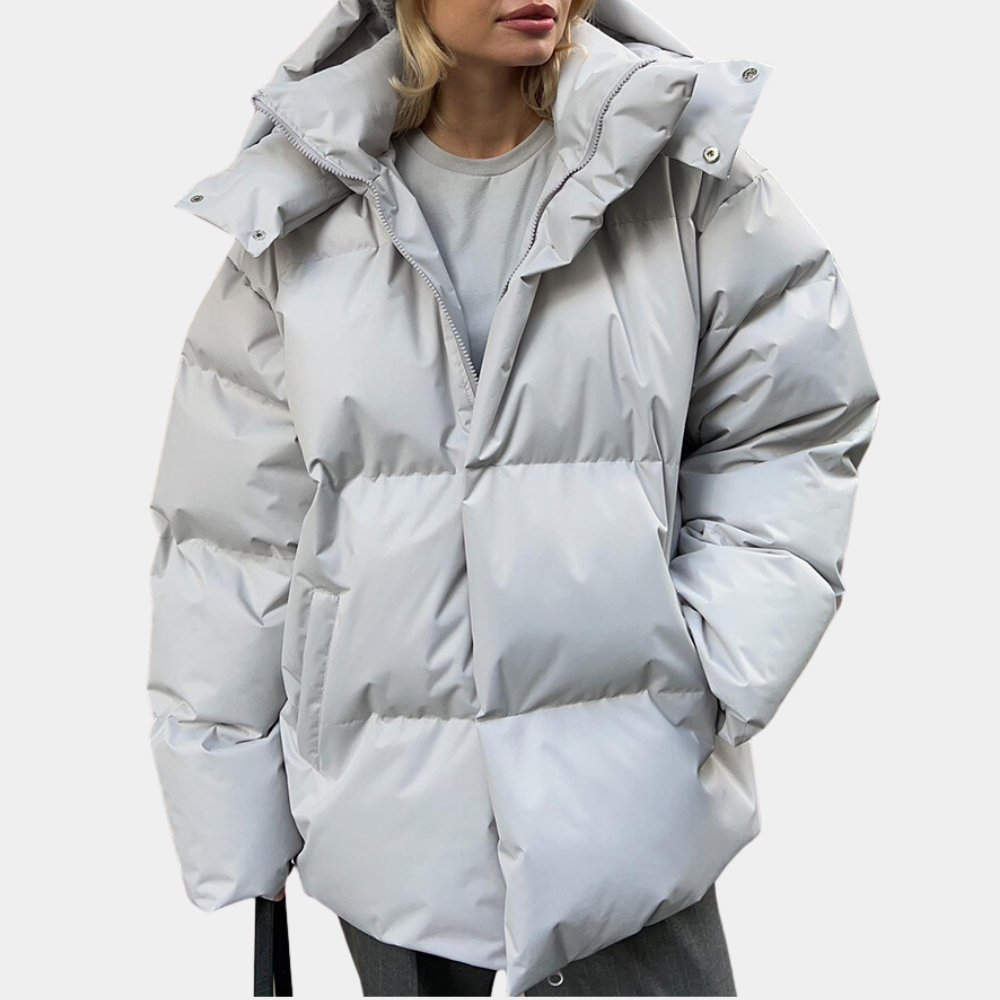 Women's oversized black quilted puffer jacket with hood, water-repellent finish for cold weather
