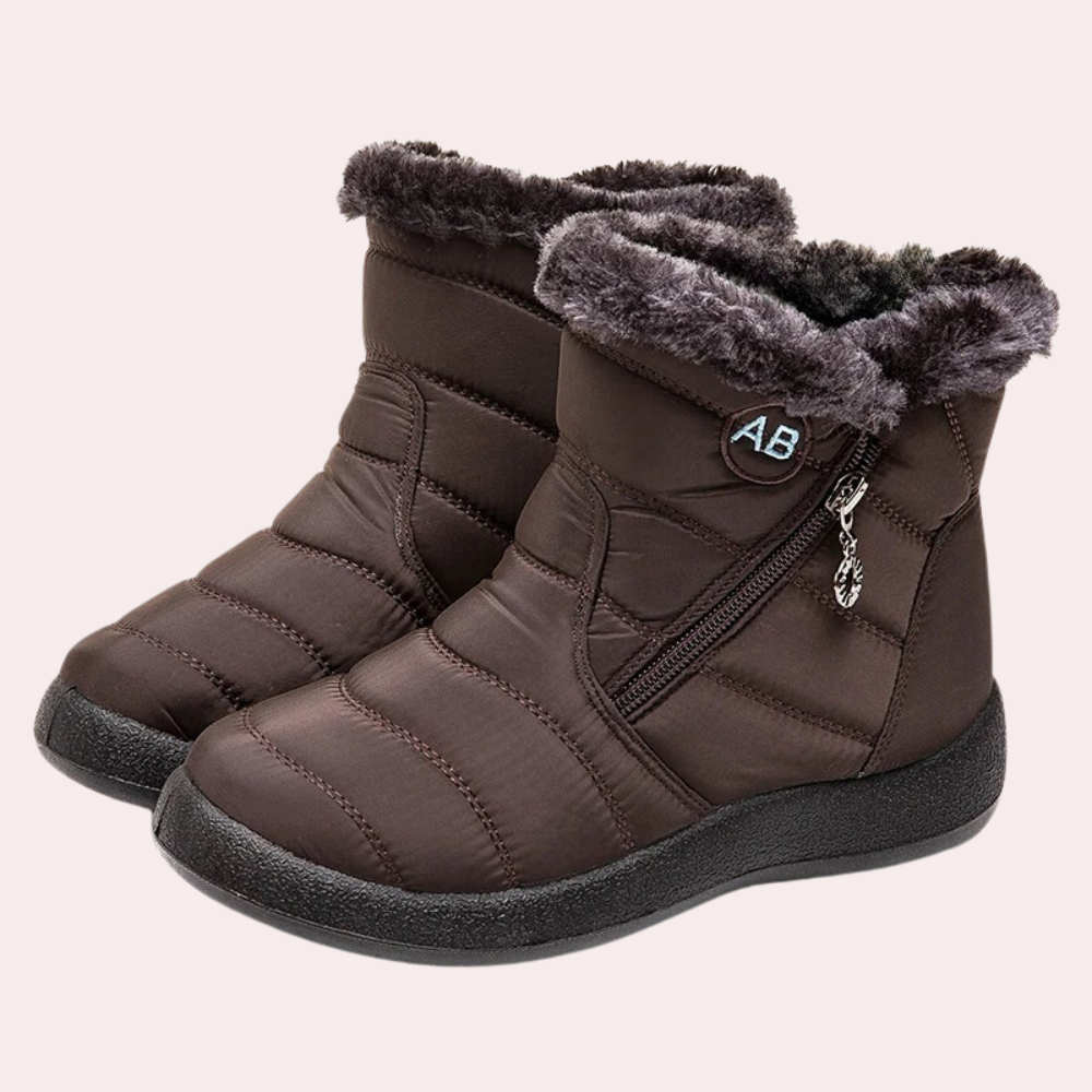 Women's black quilted boots with faux fur lining, side zipper, and non-slip winter sole