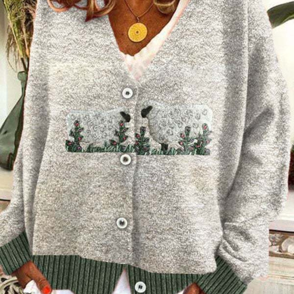Women's relaxed fit V-neck knit cardigan with button closure featuring playful sheep motif