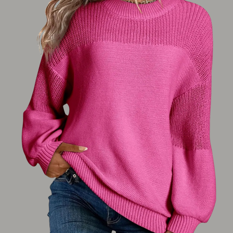 Beige loose-fitting knit sweater with relaxed drape and soft cozy texture for casual elegance