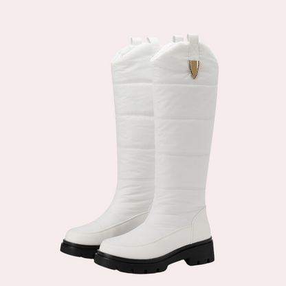 Women's black knee-high boots sleek fit polished PU leather quilted shaft rugged sole
