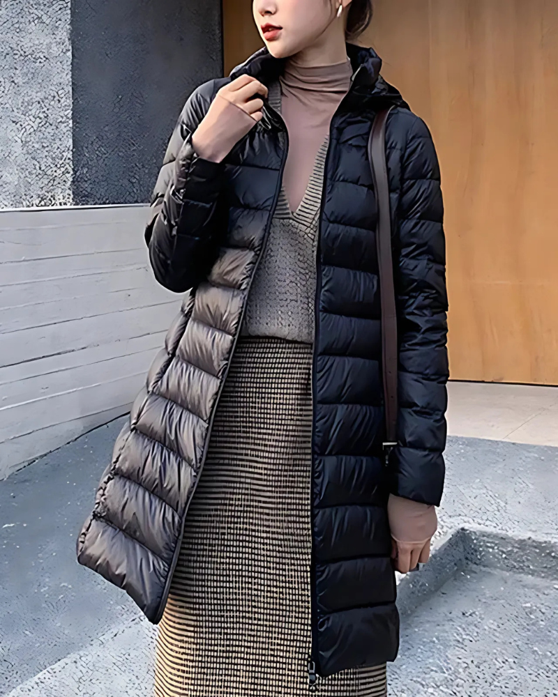 Women's slim-fit mid-length quilted puffer jacket with insulated hood, sleek silhouette