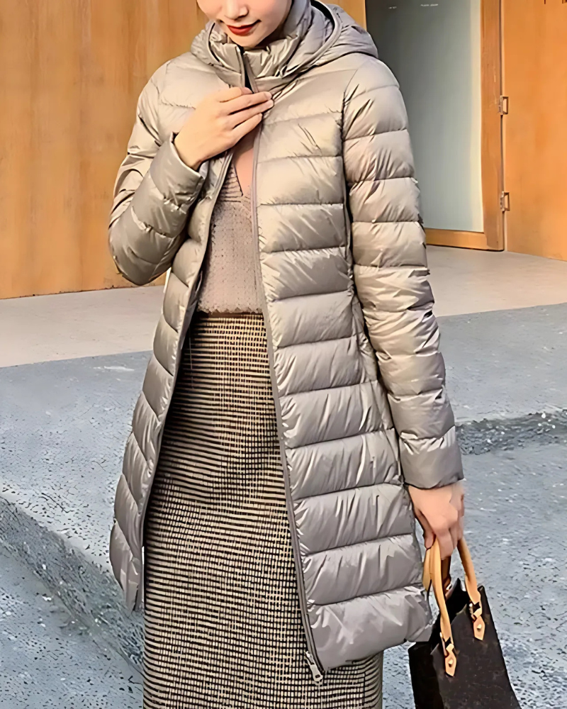Women's slim-fit mid-length quilted puffer jacket with insulated hood, sleek silhouette