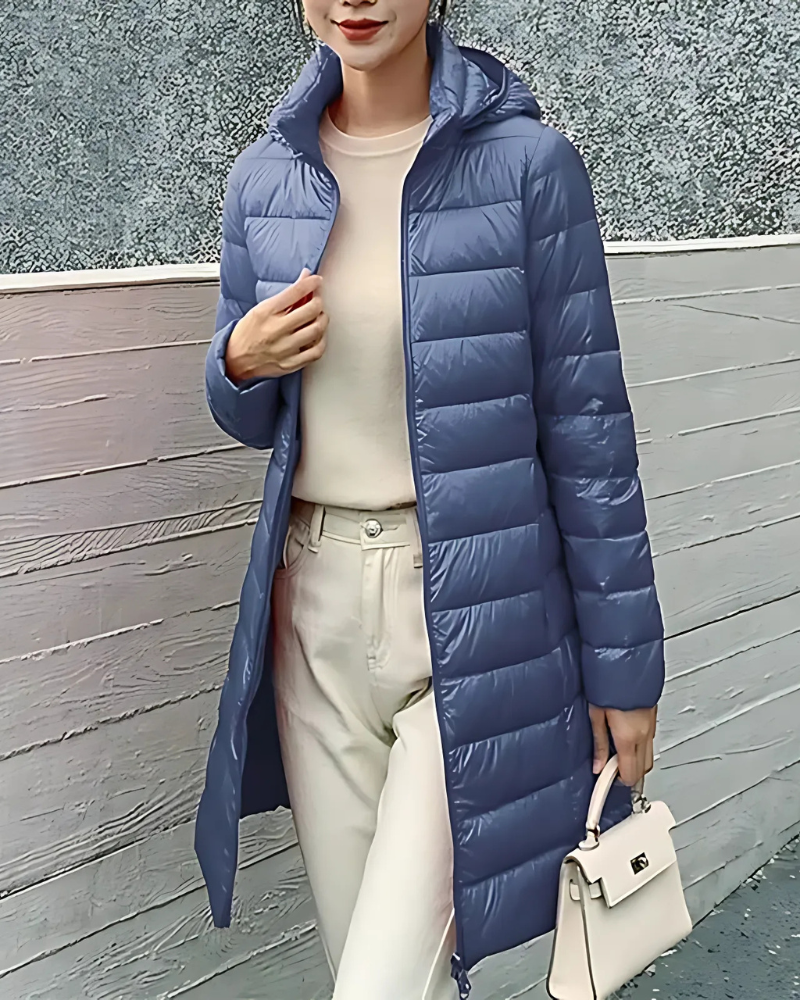 Women's slim-fit mid-length quilted puffer jacket with insulated hood, sleek silhouette