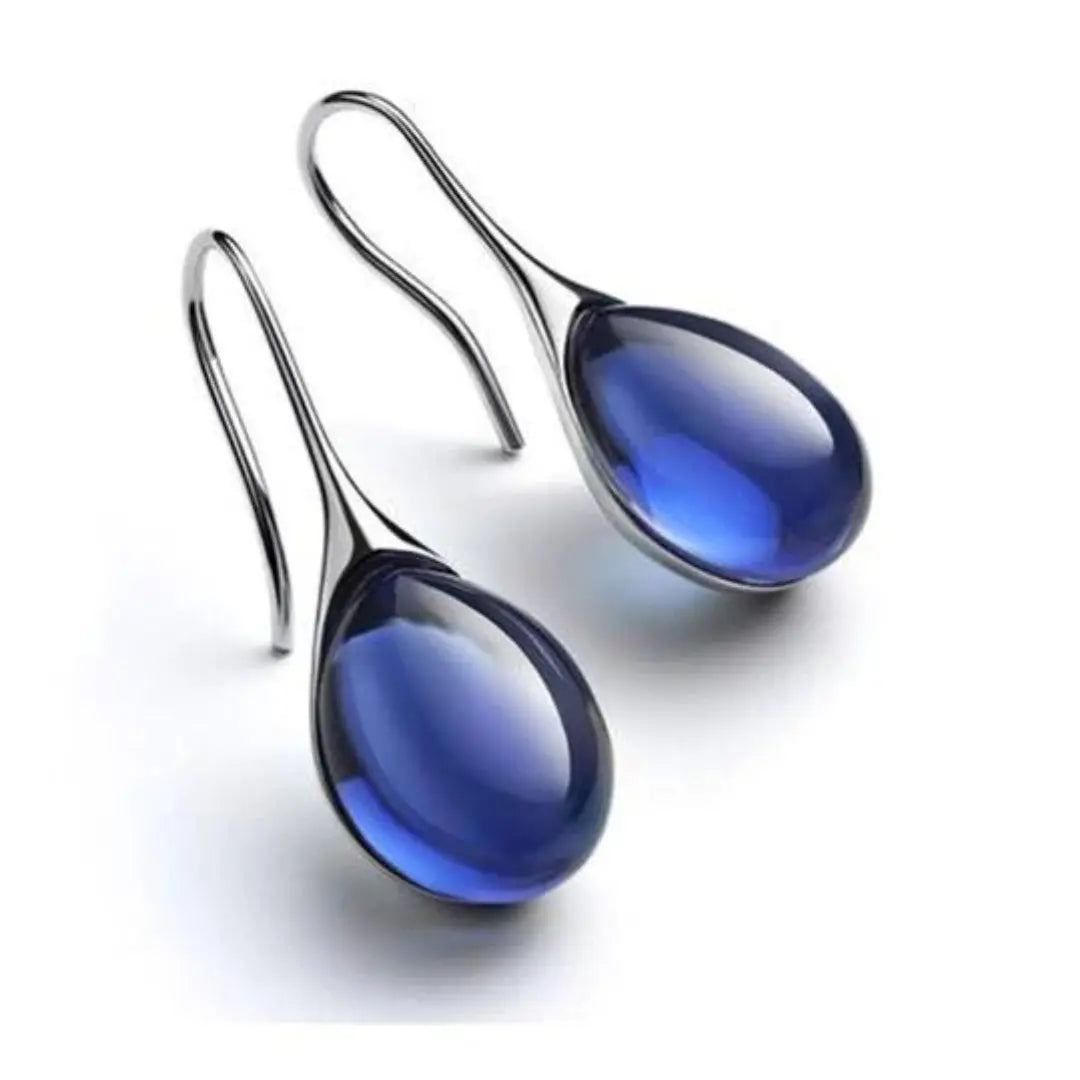 Denise gold-plated teardrop earrings with amber resin centerpiece, lightweight minimalist design