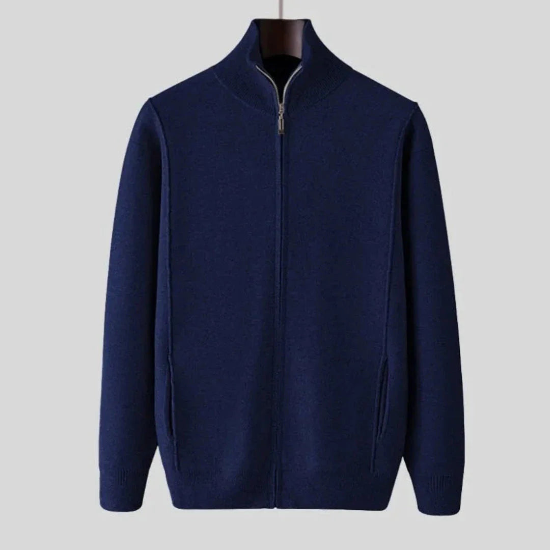 Men's full-zip wool sweater in neutral tone, fine-knit texture with tailored ribbed trim and side pockets