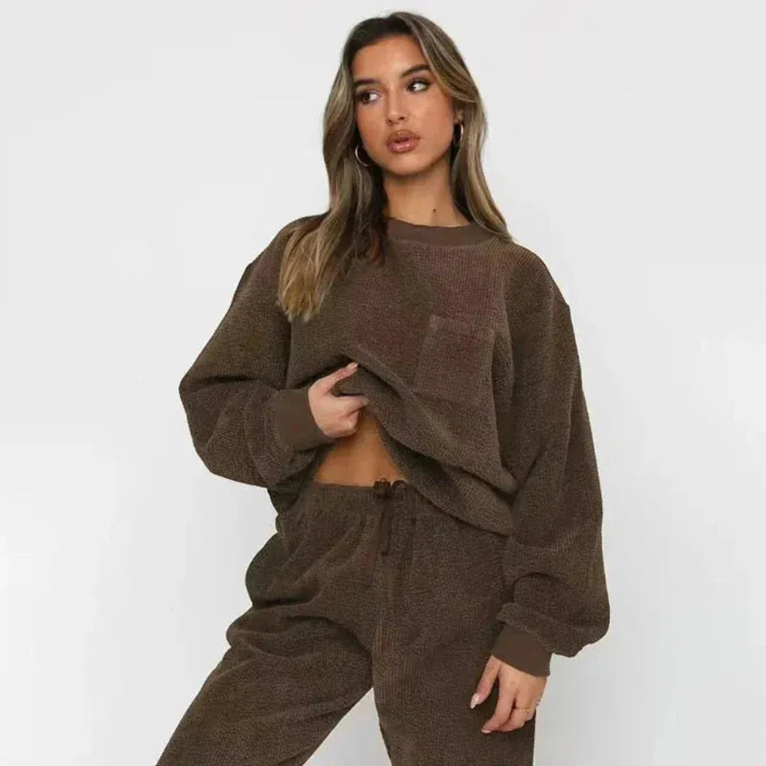 Beige corduroy oversized loungewear set with long-sleeve top, chest pocket, and matching drawstring joggers