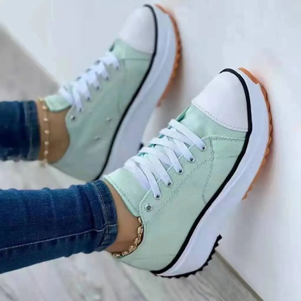 Women's white canvas platform sneakers with thick cushioned sole, casual chic everyday style